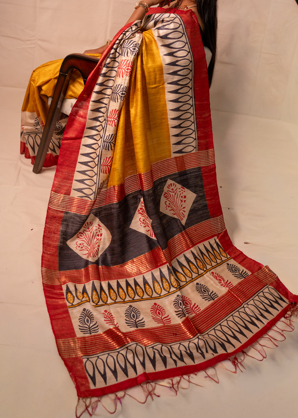 Abhira Yellow, Black & Red Gheecha Silk Saree